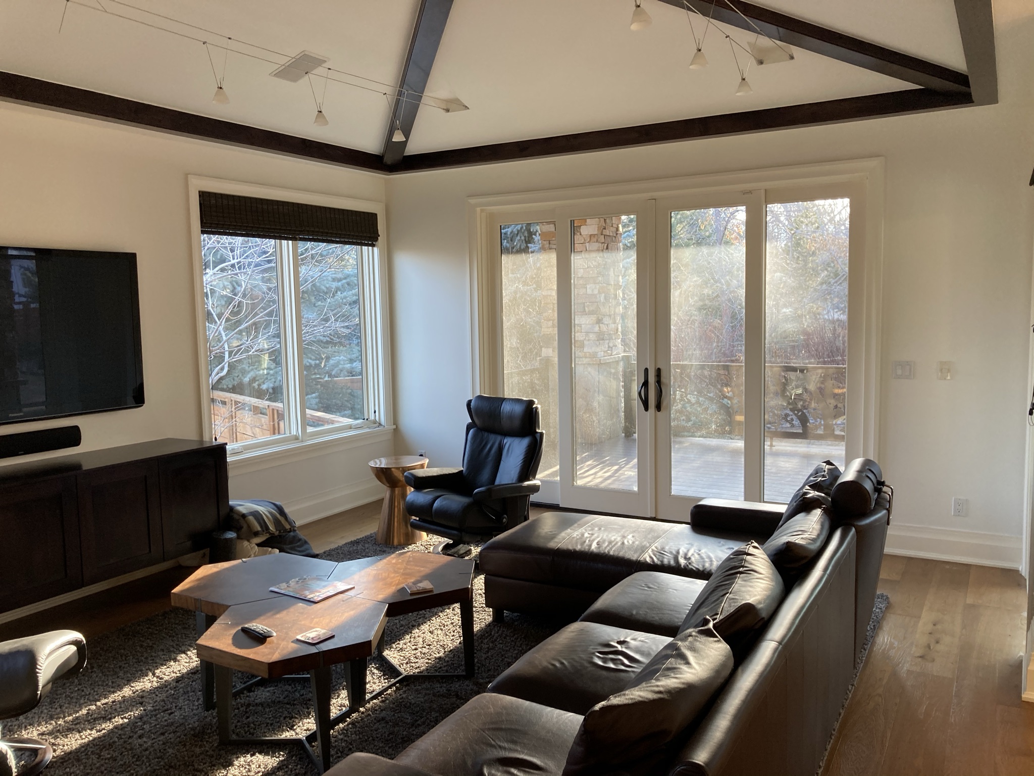 Original great room before renovation, highlighting the existing ceiling, windows, and living spaces prior to the comprehensive remodel.