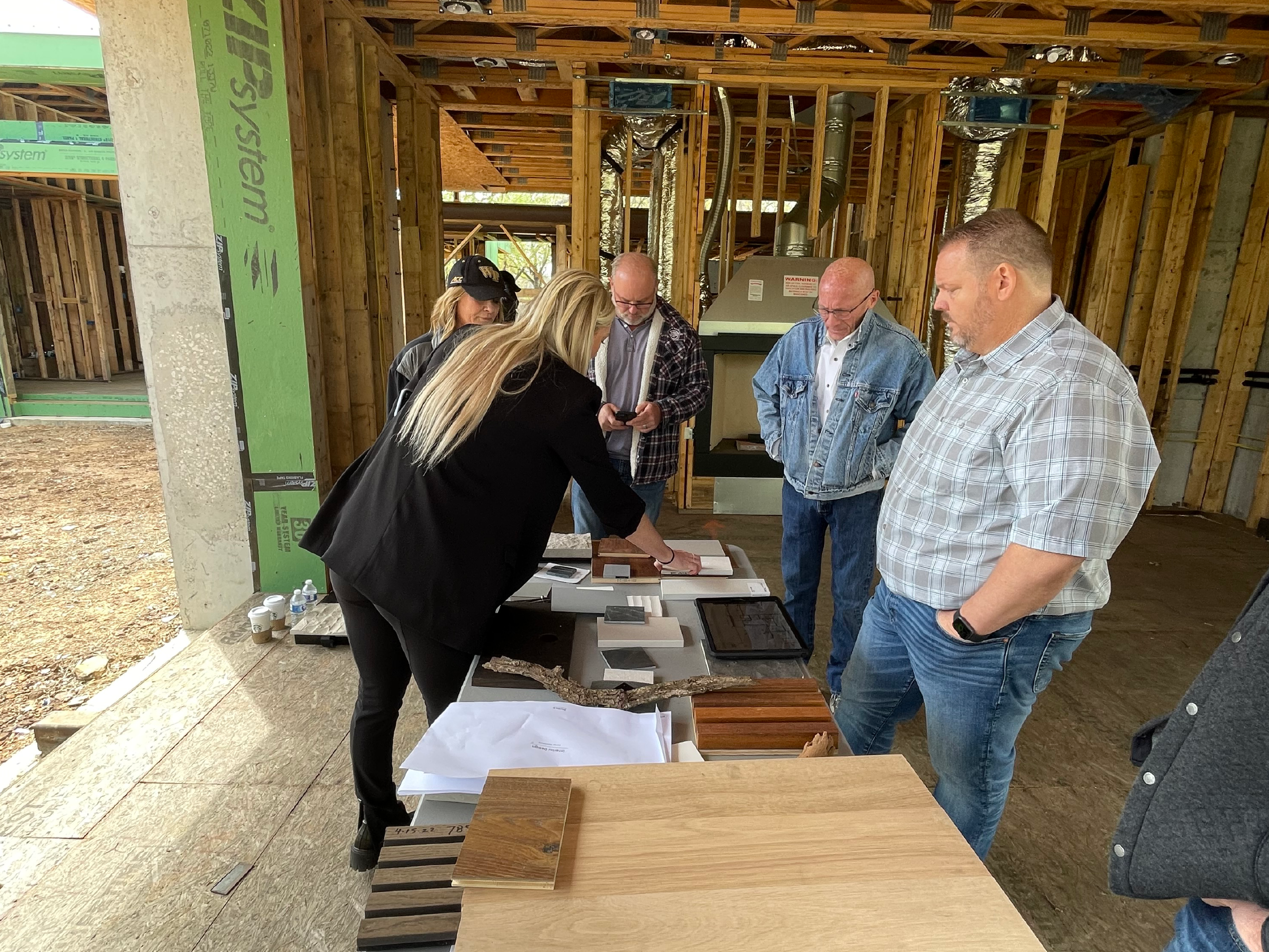 Reviewing material samples with builder and team during construction