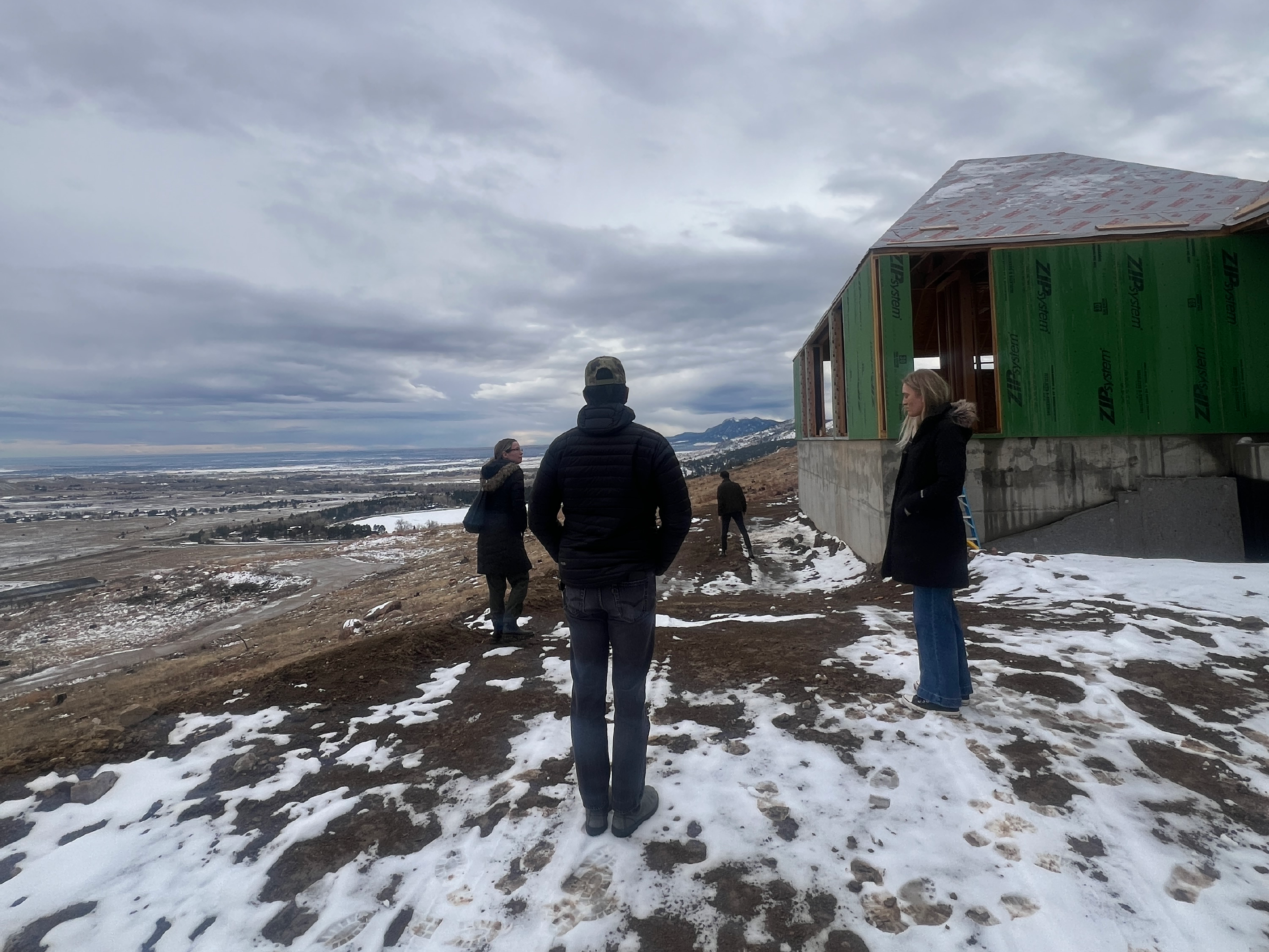 Architects walking a mountain site during early construction phase