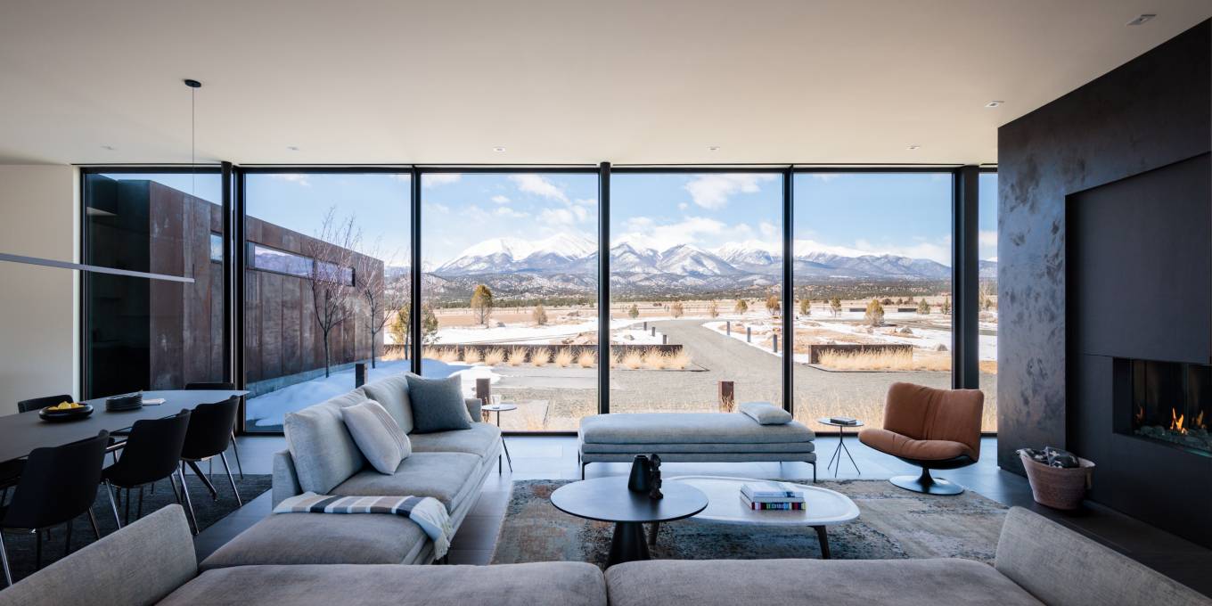 The design of the living spaces simultaneously connects the users to the incredible views