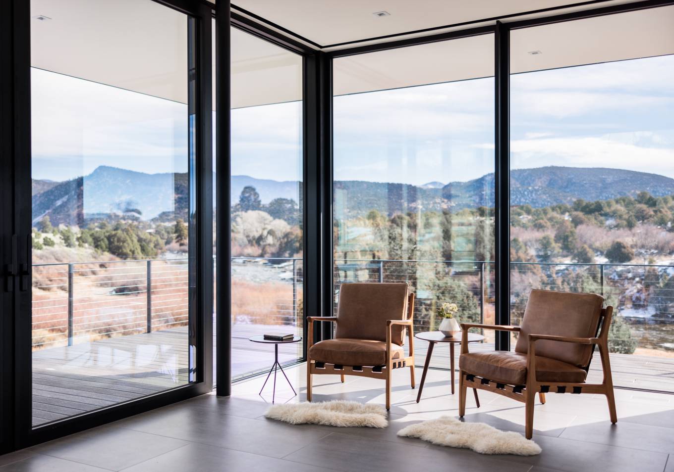 The design of the living spaces simultaneously connects the users to the incredible views
