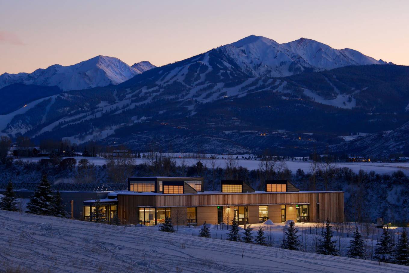 The Aspen Community School includes a new classroom & community building that is fully integrated into the site