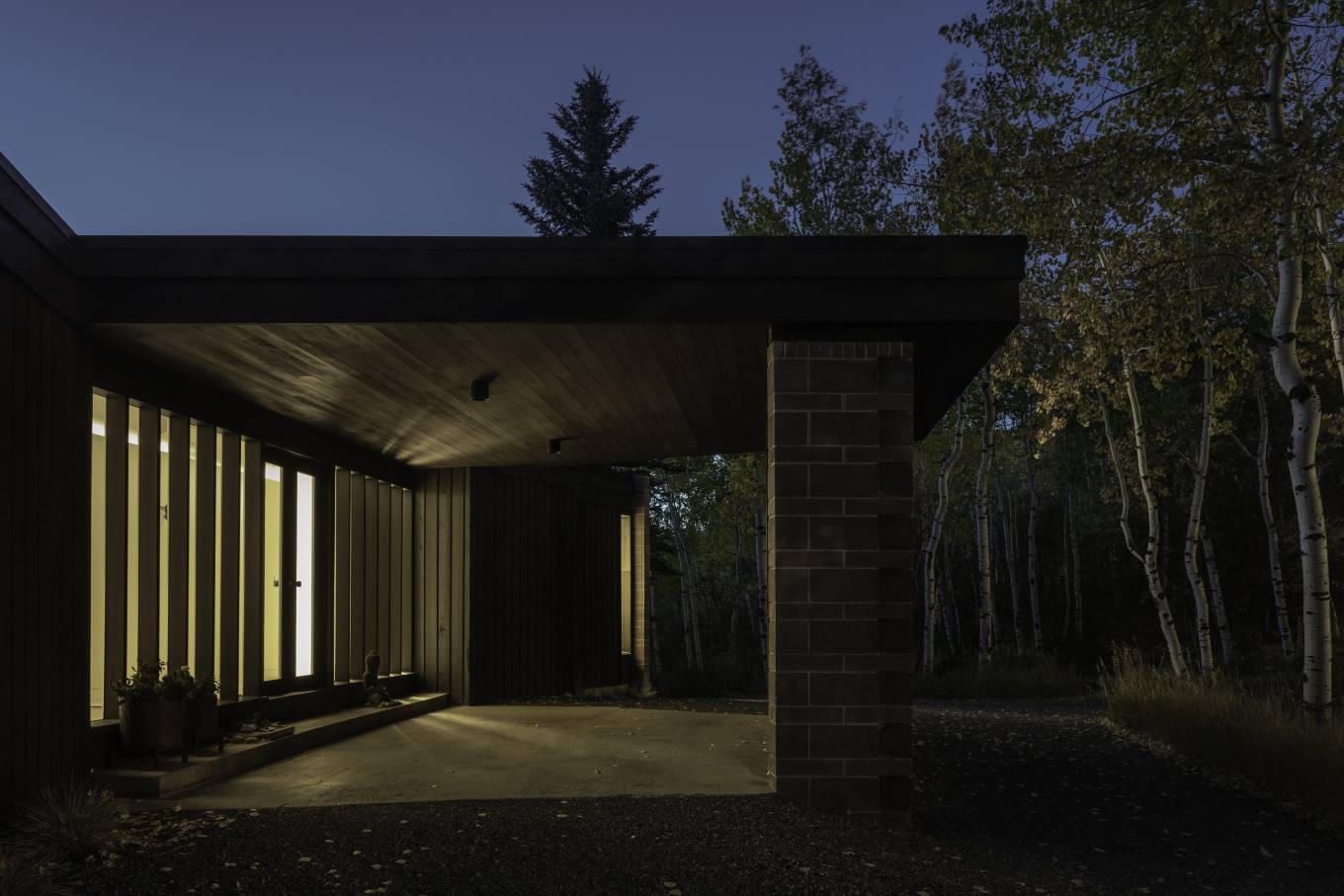 Originally constructed in 1968, this modest mid-century house was completely renovated and thrives in its surrounding aspen forest on a sloping hillside while enjoying the seasonal changes within its high-alpine landscape.